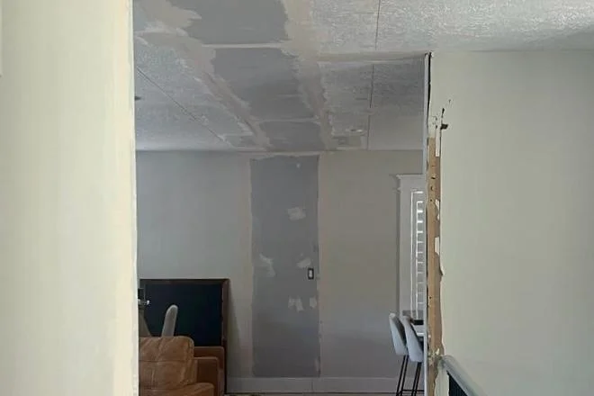 Damaged drywall before professional repair